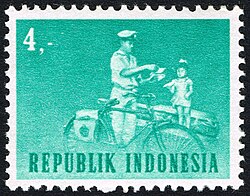 Man on bicycle with child